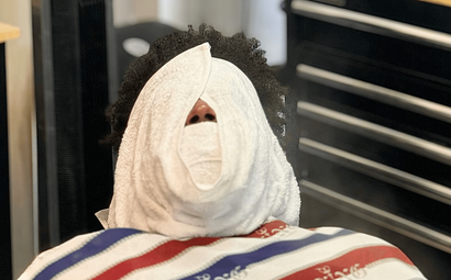 Hot towel tratment at Rashada's Cuts and More located in Dothan Alabama